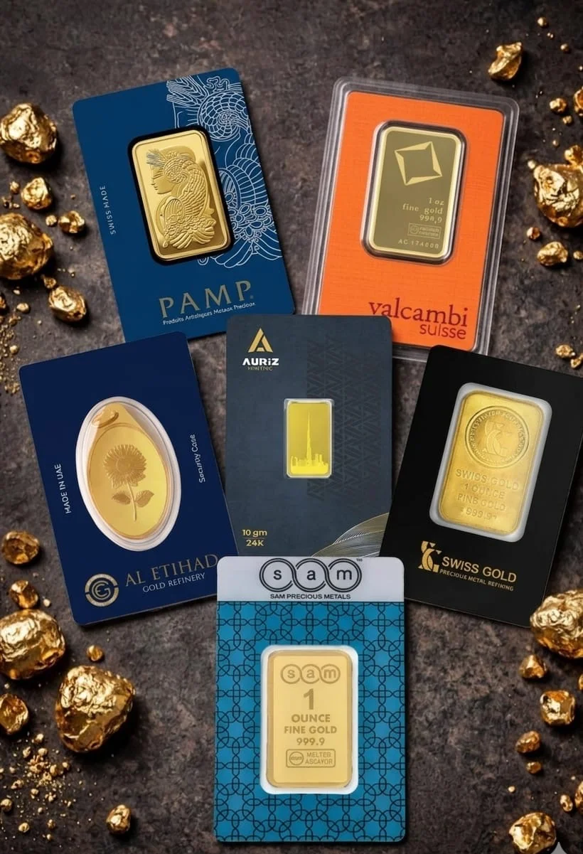 Gold bullion bars collection including PAMP Suisse, Valcambi and Emirates Gold